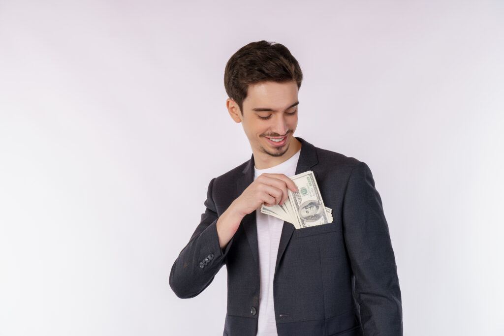 Smiling man holding cash representing faster reimbursements