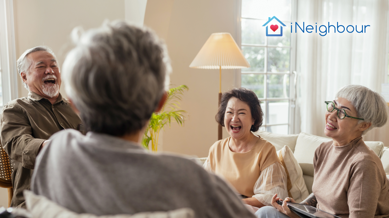 Malaysian residents conducting a meeting in a living room to discuss residents association matters.